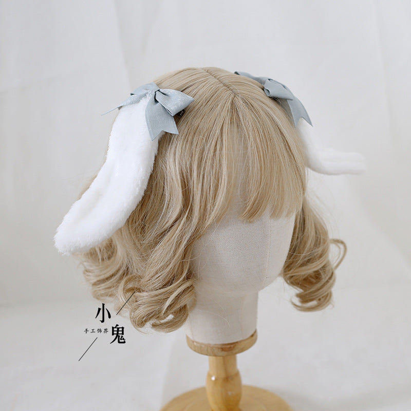 Handmade Sweet Ears Lolita bunny ear bowknot hair clip with OP dress for Lolita fashion by LolitaFetch, displayed on a model.