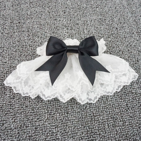 White lace Lolita cuff with a black bow