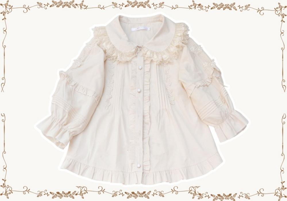 White Kawaii Lolita blouse with Peter Pan collar, double lace and ruffled sleeves.