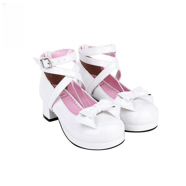 White bow-front Lolita shoes with crossover ankle straps, rounded toes and thick heels