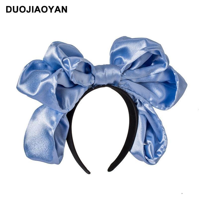 Handmade oversized satin and lace LolitaFetch hairband with a large bow, styled as a vintage Lolita or kawaii hair accessory.