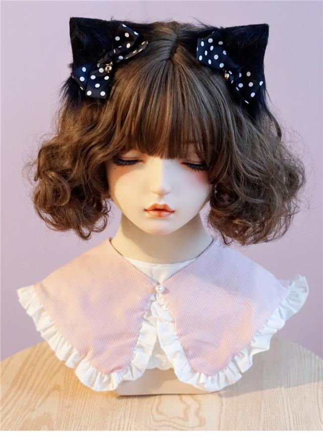 Black and pink handmade faux fur plush cat ear hair clip with animal ear design, ideal for Lolita fashion and cosplay accessories.