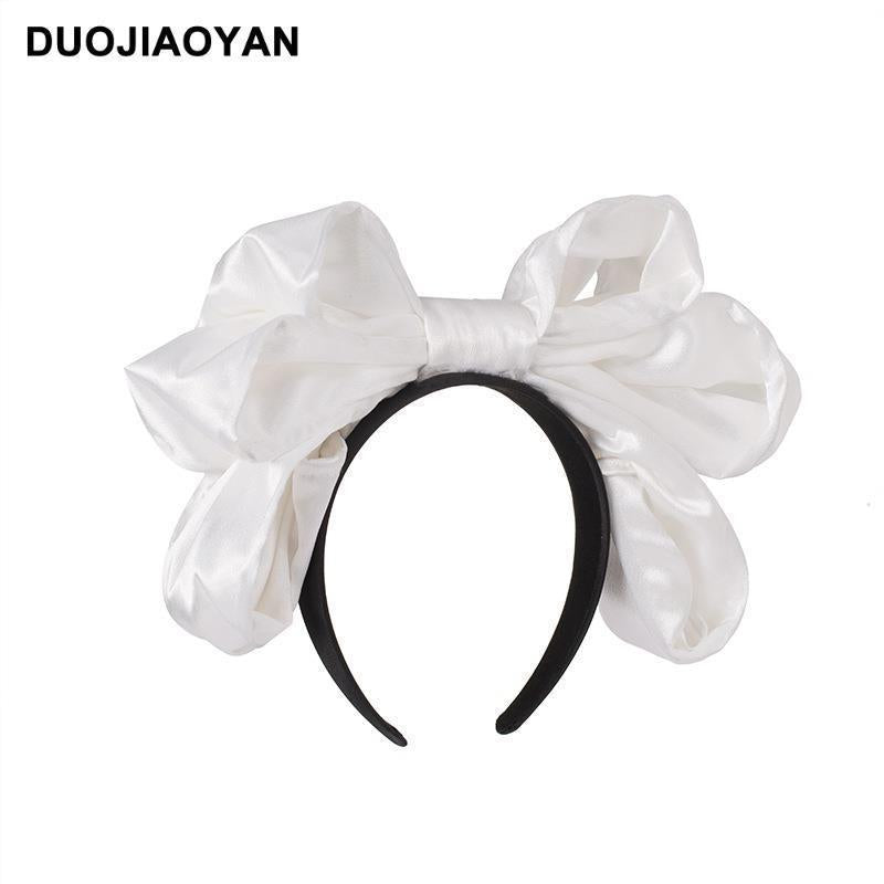 Handmade oversized satin and lace Lolita Fetch hairband with a large bow, perfect as a stylish lolita hair accessory.