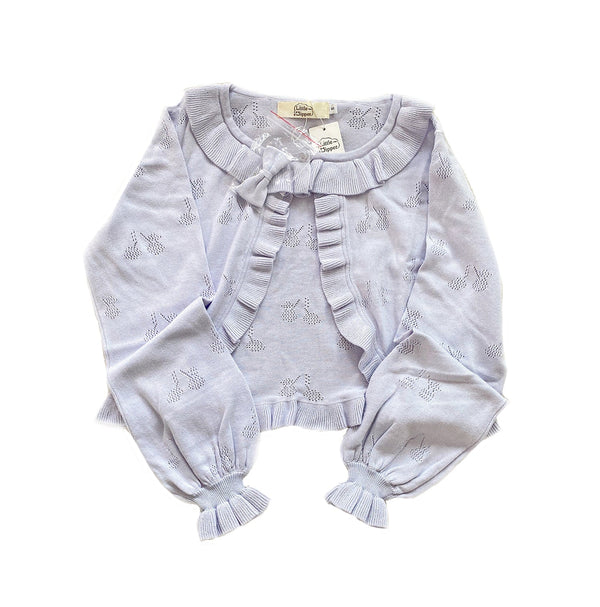 Light purple long-sleeved cardigan with ruffle collar, cuffs and cherry-pattern openwork laid flat.