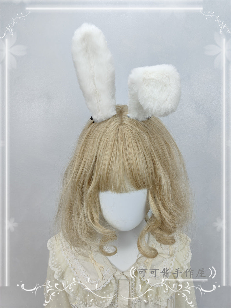 Pure white plush rabbit ear hair clip and headband by LolitaFetch, featuring realistic lop ear design for cosplay and lolita fashion.