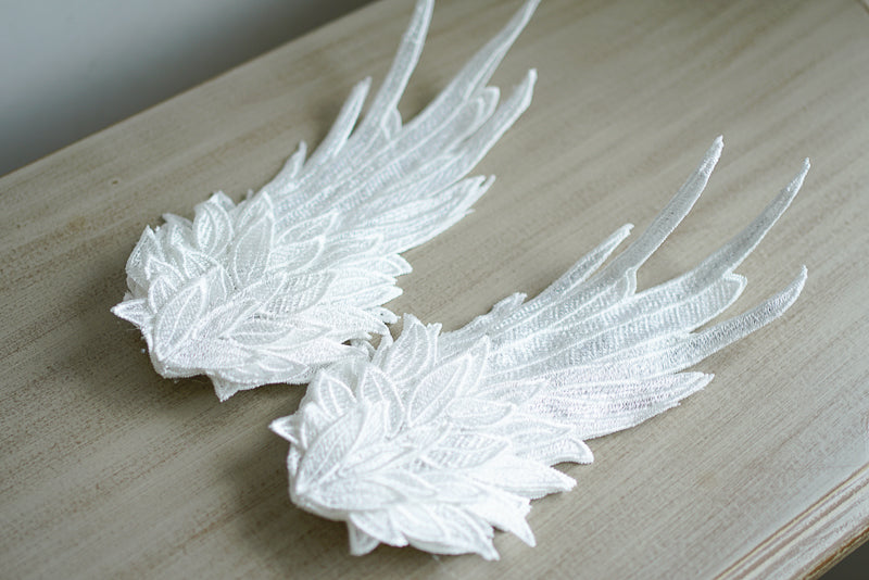 Black and white embroidered angel wings LolitaFetch headdress with feather design, perfect for Lolita fashion and elegant hair styling.