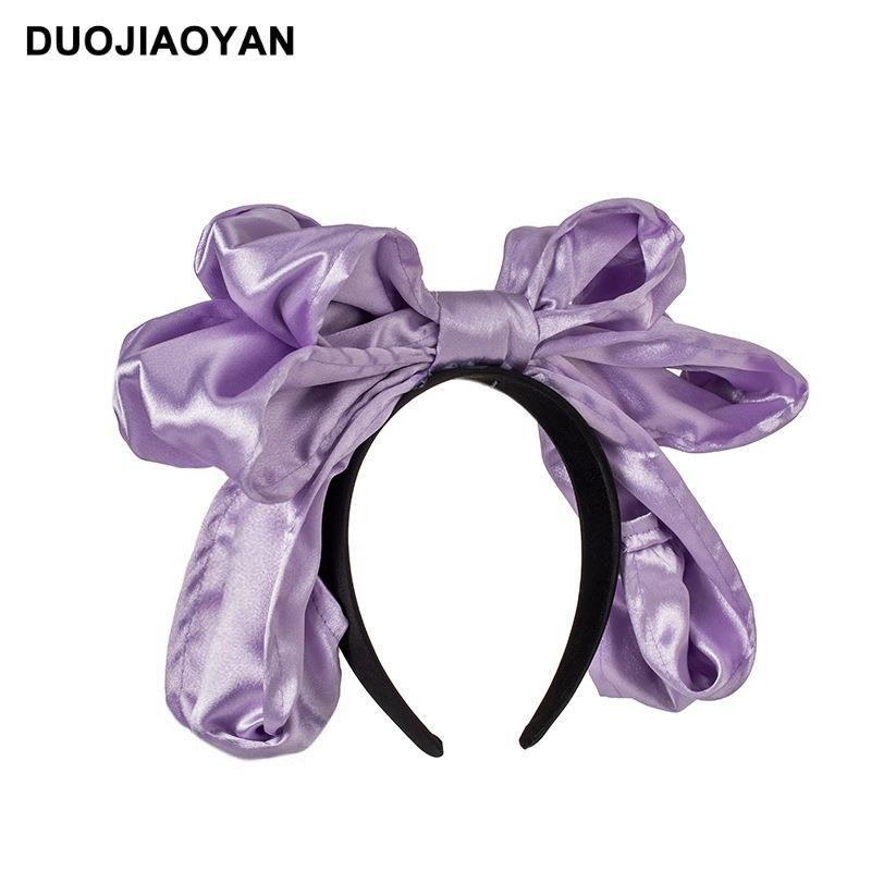 Handmade oversized satin and lace LolitaFetch hairband with a large bow, perfect as a stylish Lolita-style headwear accessory.