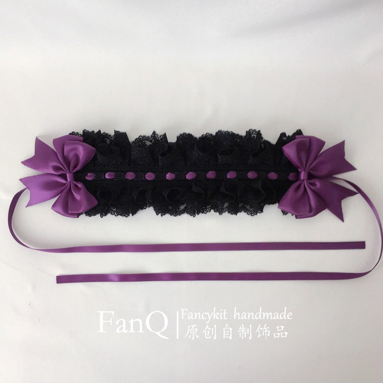 Black and purple Gothic doll rose hairband by LolitaFetch, featuring a decorative headdress with floral accents and lace details.