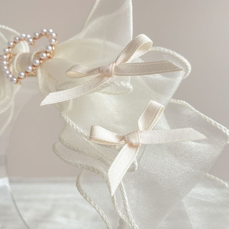 Handmade LolitaFetch organza bow pearl hair accessory with delicate bow and pearl accents, perfect for Lolita fashion styling.