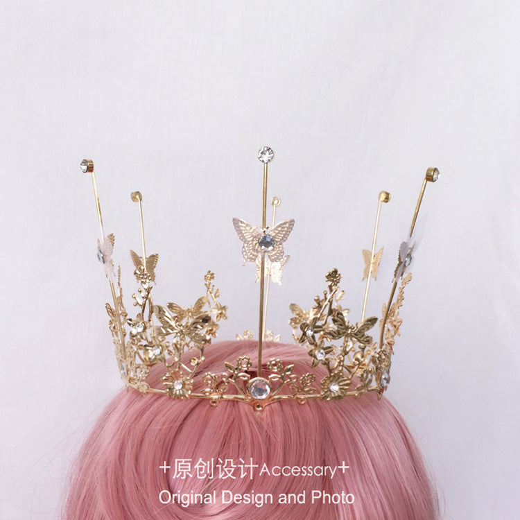 LolitaFetch Lolita girl crown headdress with pearls, butterfly rhinestones, and European court-inspired retro design in intricate detail.