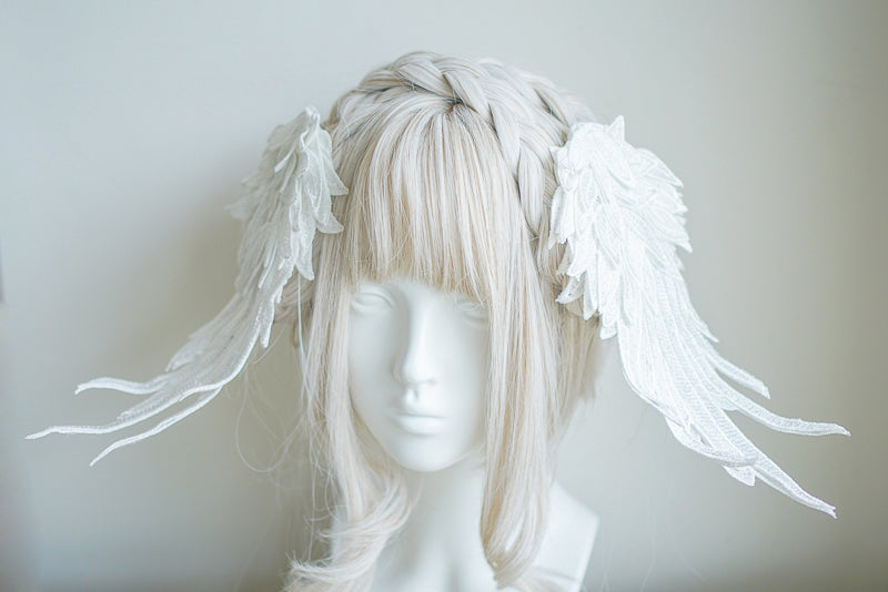 Black and white two-tone embroidered angel wings hair clip headdress by LolitaFetch with feather design and intricate detailing.