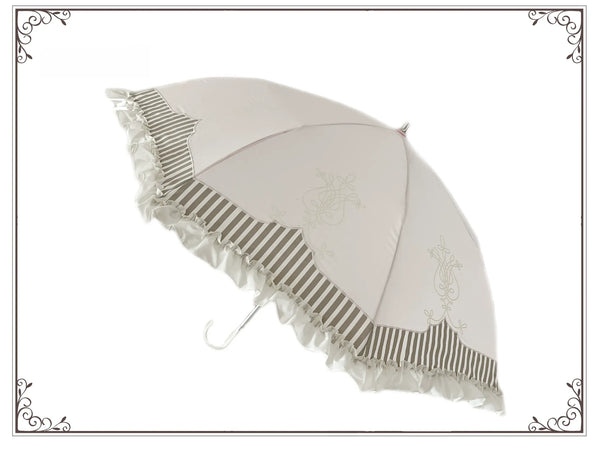 Ivory Classic Lolita parasol with lyre print, striped panels, and ruffled edge