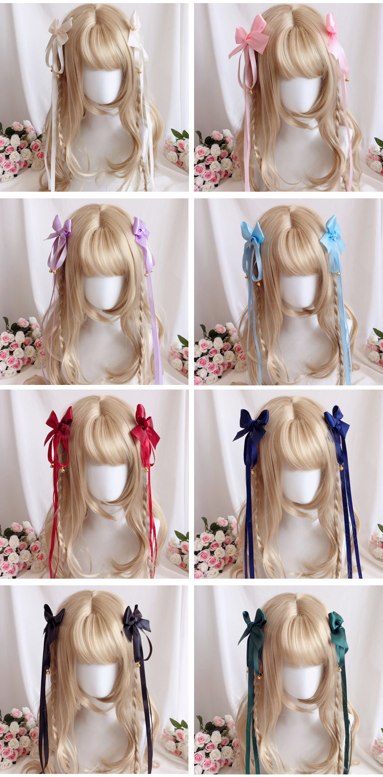Girl's Lolita hair clip with a bowknot and long ribbon, featuring a bell charm, in a cute and sweet headdress style.