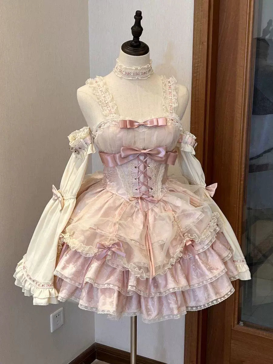 Black and pink Rose Butler JSK displayed on a mannequin with layered ruffles, bows and lace trim.