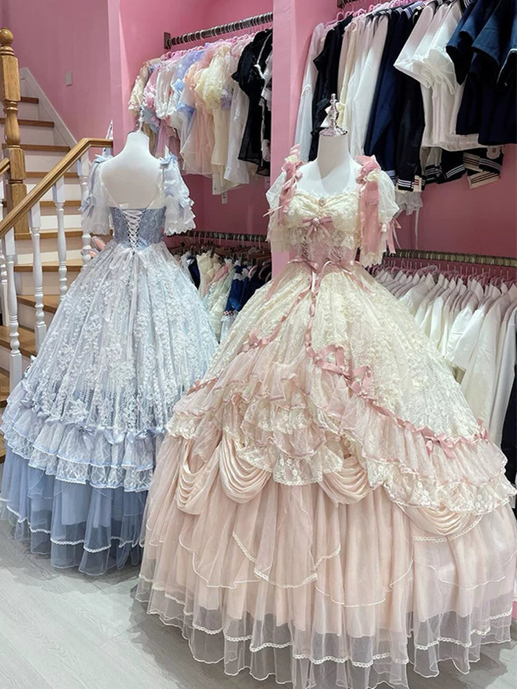 Light blue Lolita dress with voluminous tiered skirt and lace hem trim on a mannequin