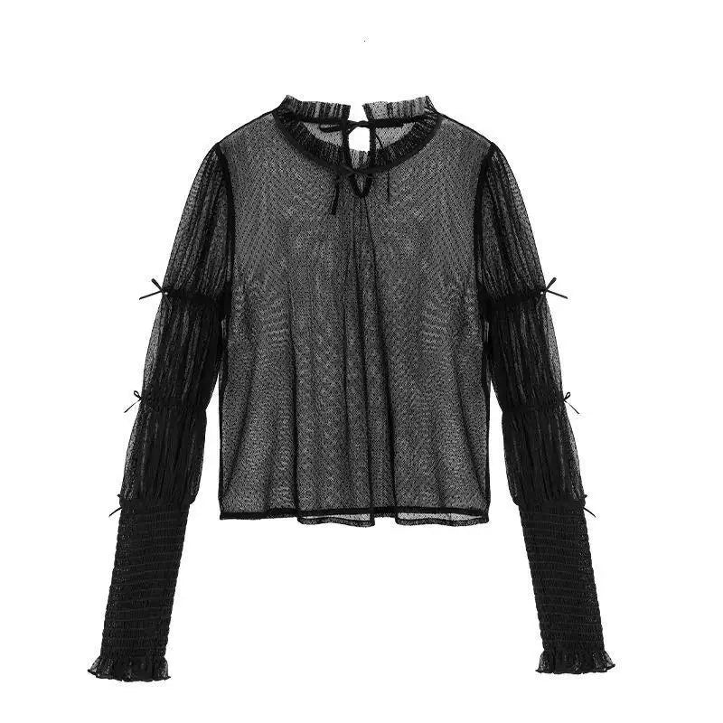 Black Lolita inner layer with dotted mesh, leg-of-mutton sleeves, a ruffled neckline, and a black JSK.
