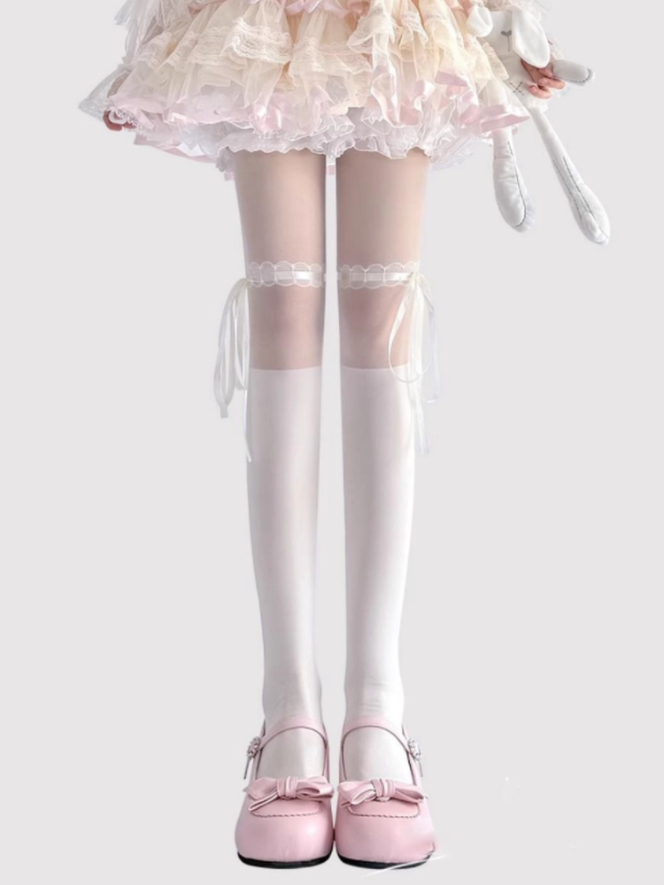 White Lolita tights with ribbon ties and bow details at the upper thigh