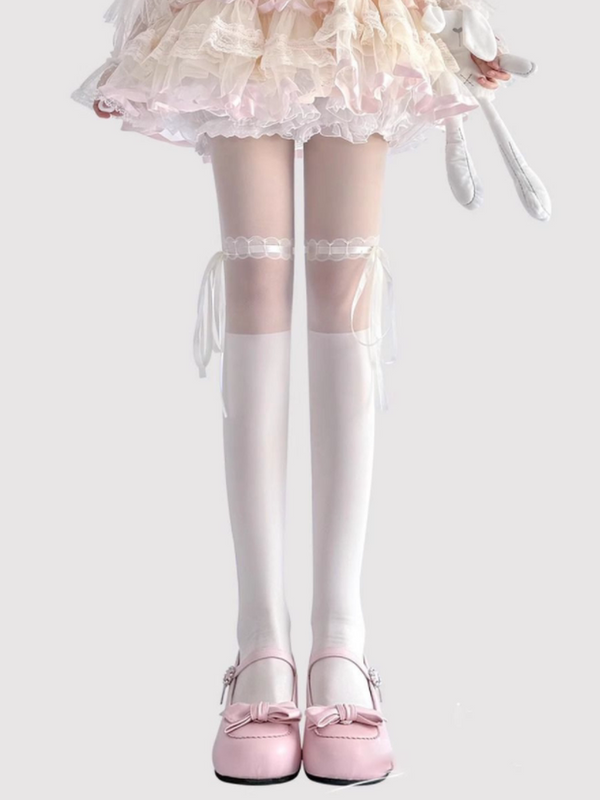 White Lolita tights with ribbon ties and bow details at the upper thigh