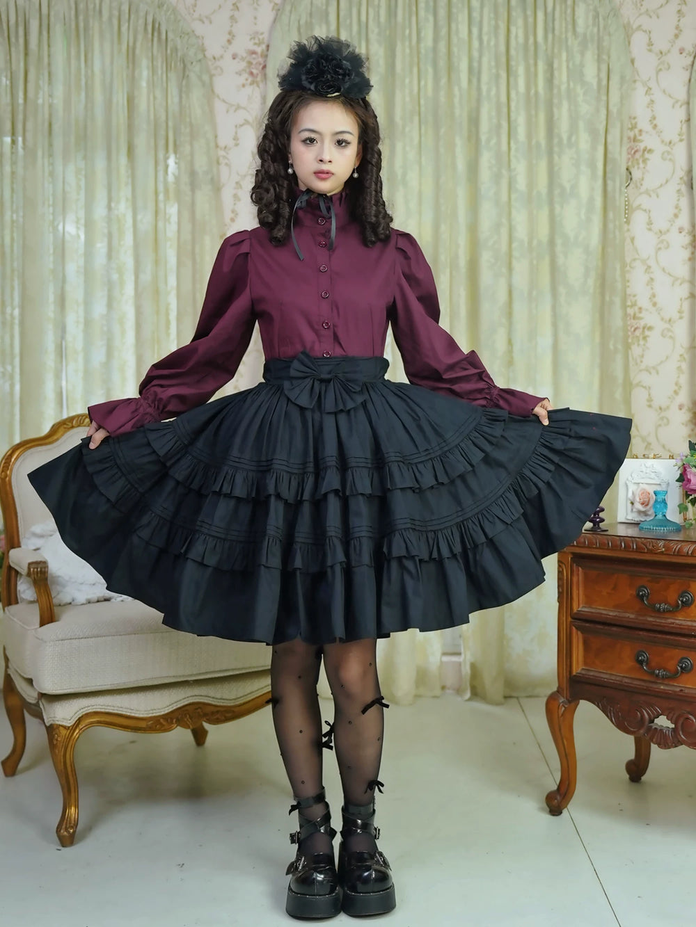 Black full-circle tiered ruffle skirt styled with a burgundy blouse