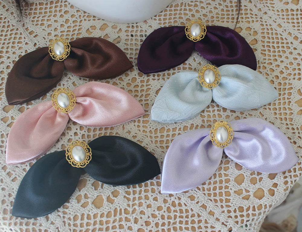 Rabbit-ear and small top-hat Lolita headwear variants in pastel and dark colours.