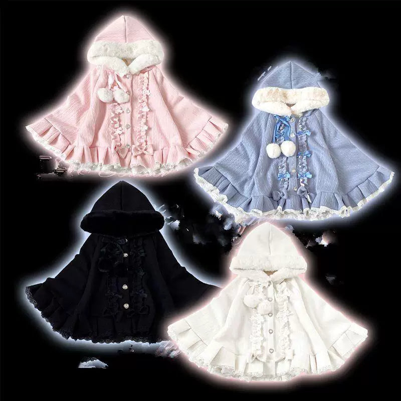Hooded cape with plush trim and pompom ties shown in several colourways.