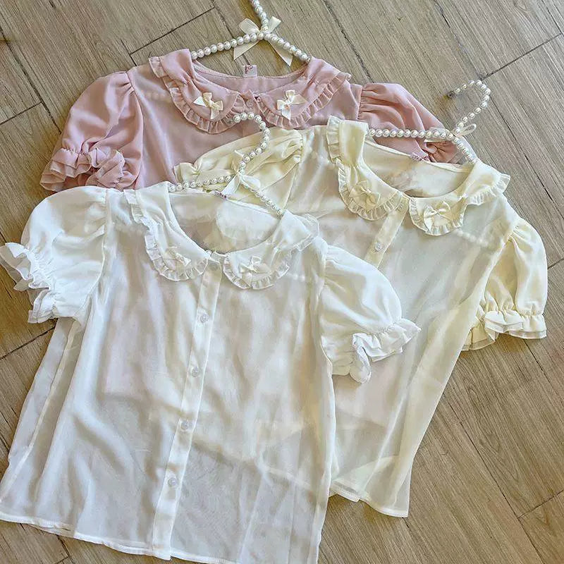 White short-sleeve Lolita blouse with ruffled collar and fabric bows