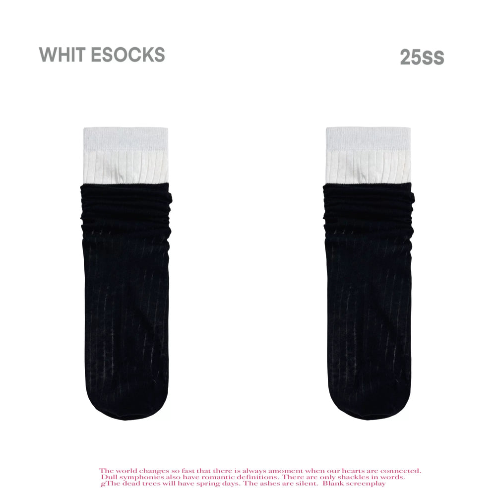 Black ribbed mid-calf socks with gathered legs and white contrast cuffs, shown flat and worn.