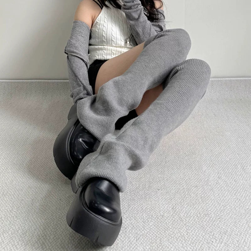 Gray and black over-the-knee knitted leg warmers shown worn