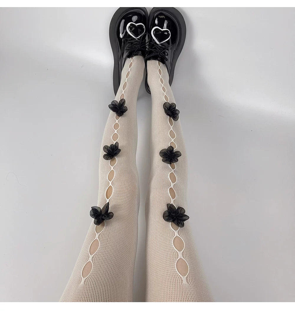 Fantasy Doll sheer tights with floral openwork panels and flower motifs
