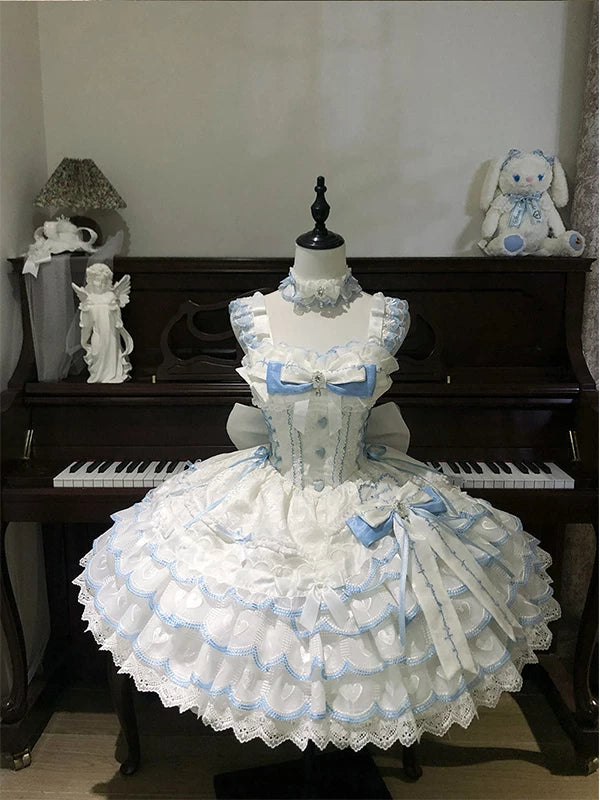 Blue-and-white ballet-inspired JSK dress with layered ruffles and bow on a mannequin