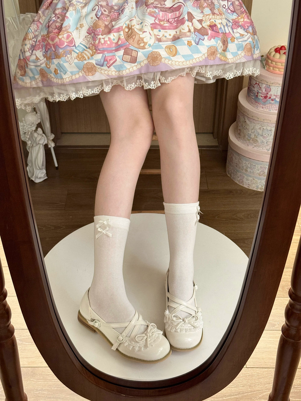 Fantasy Doll white mid-calf socks with small lavender bows styled with a pastel Lolita outfit.