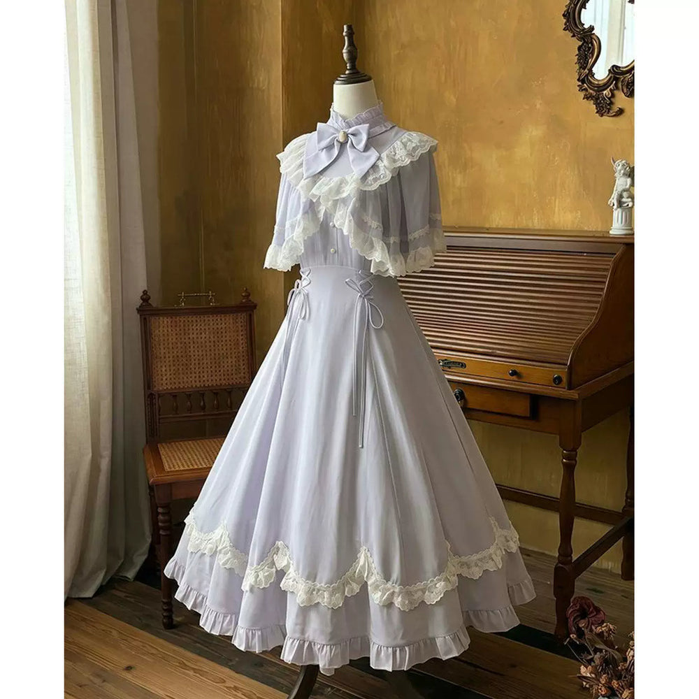 Creamy pale lavender-white one-piece dress with lace capelet and bow collar