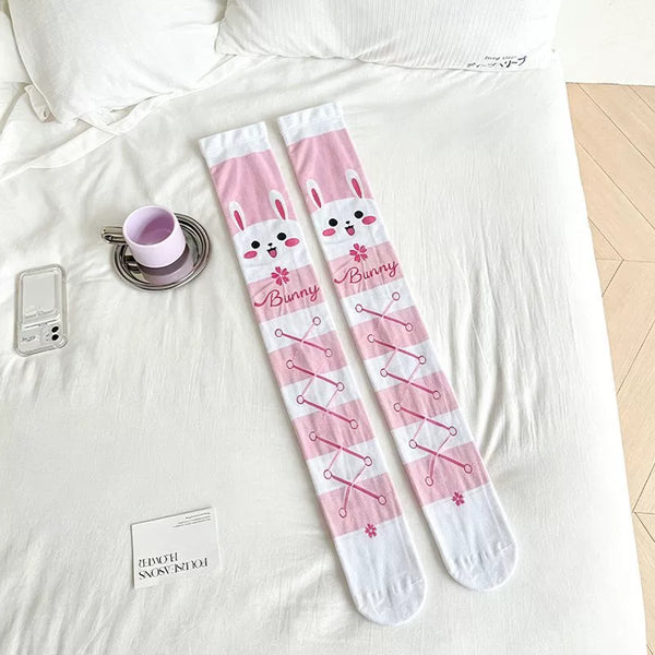 Printed over-the-knee socks styled with a layered pastel Lolita outfit