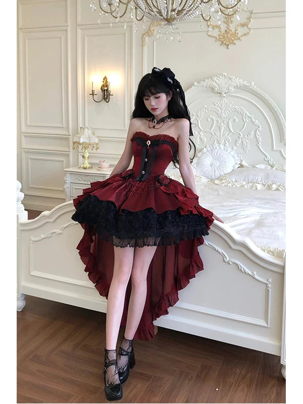 Creamy red corset-style JSK with black rose trim, bow and long train