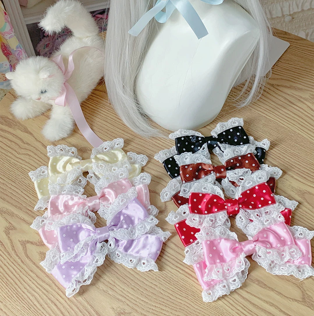 Polka-dot bow hair clips with white lace edging in multiple colourways