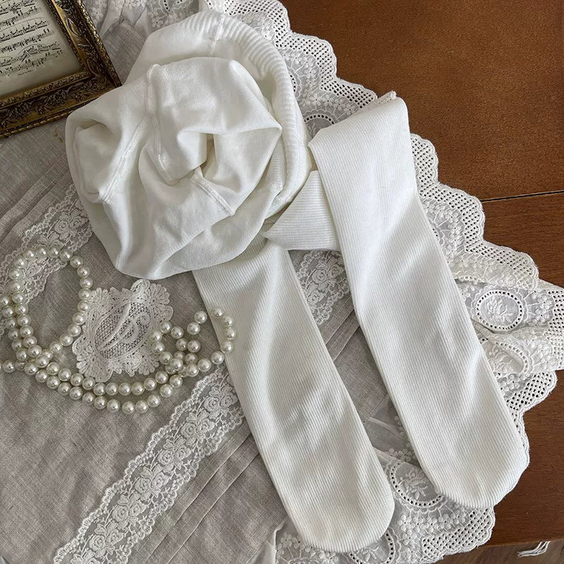 White fluffy leg warmers with polka dot cuff and front bow detail, one size
