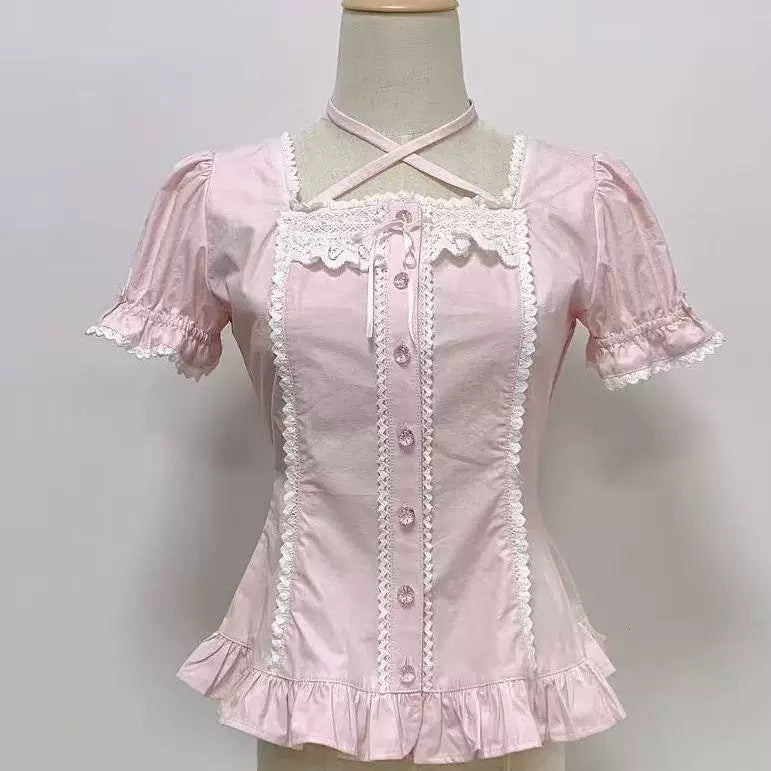 Sweetheart Dream Machine white and pink short-sleeve blouses with puff sleeves and ruffled trim.
