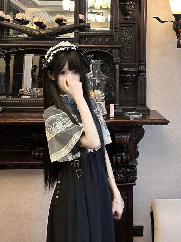 Detail of scalloped lace trim on short sleeves and sheer bodice overlay