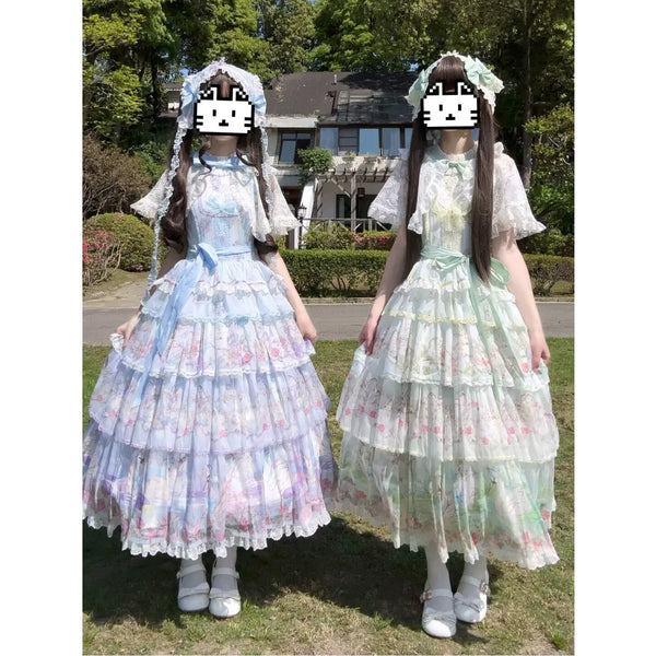 Blue and green swan-themed JSK dresses with layered lace tiers and matching accessories