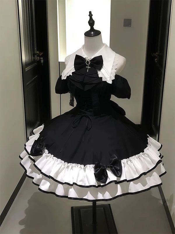 Gothic Lolita OP dress in black and white with off-shoulder sleeves and bow accents