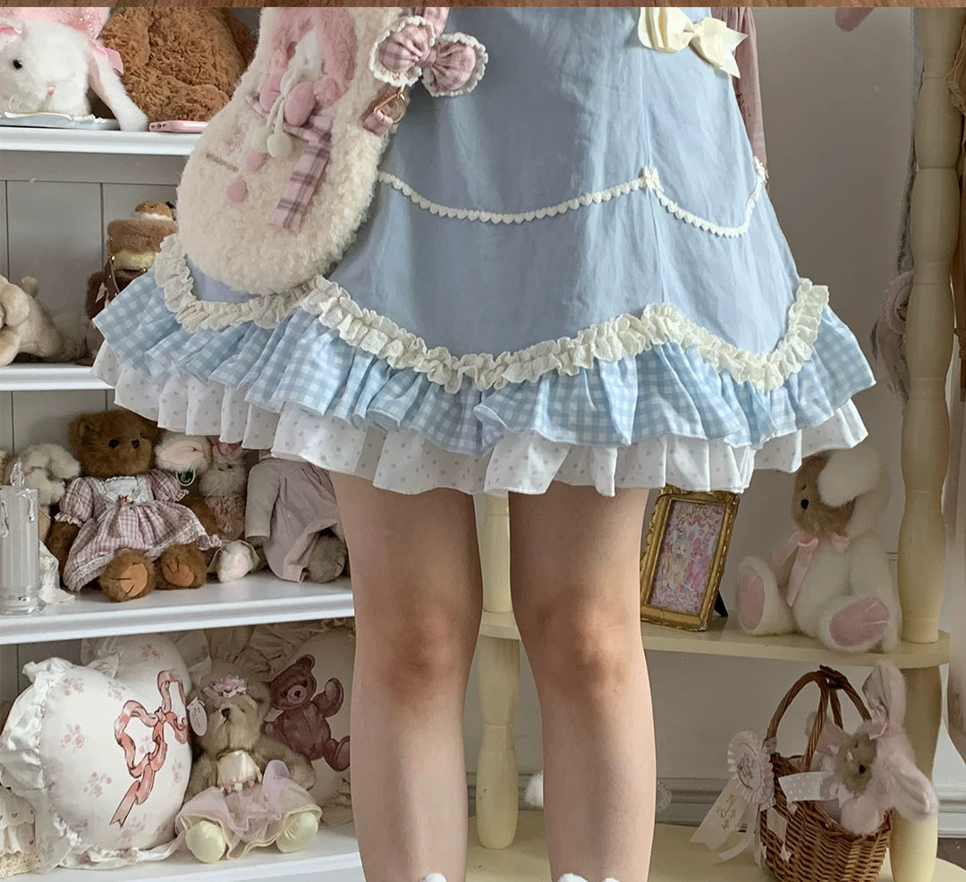 White bunny-ear socks with lace cuffs and polka-dot bows arranged with pastel colourways