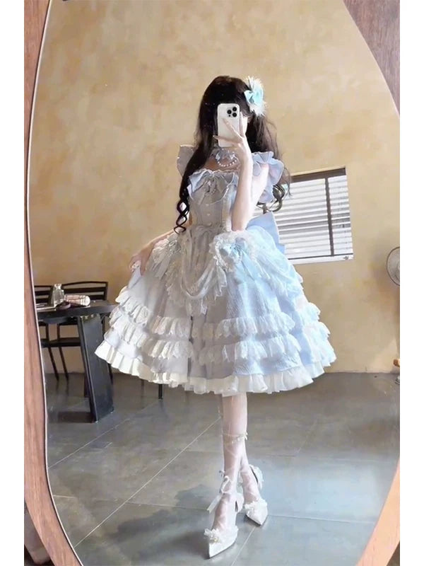 Blue doll-inspired Lolita skirt with bow train shown in mirror styling views