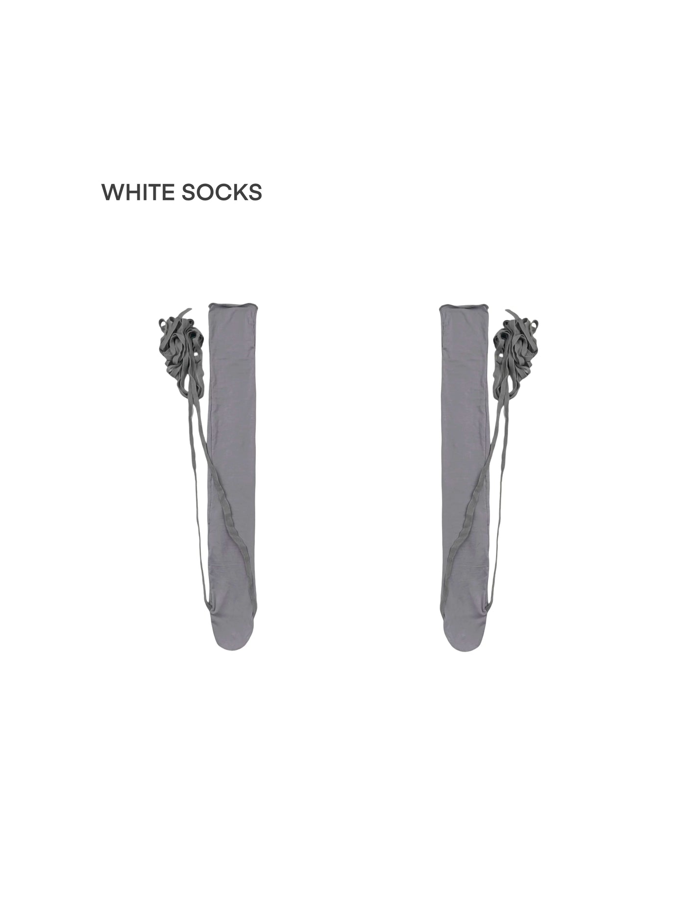 Grey and white ruched over-the-knee socks with wraparound ties styled with black heels.