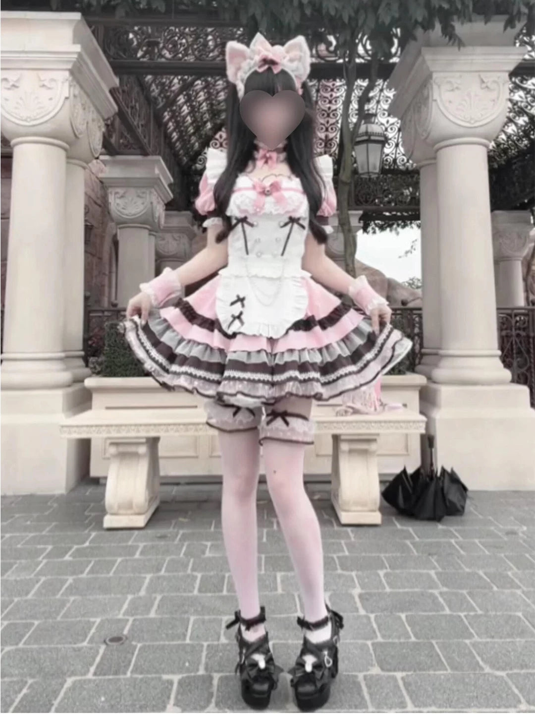 Sweet Lolita two-piece dress and apron set with pink short sleeves, white lace-trimmed bodice, and multi-tiered skirt