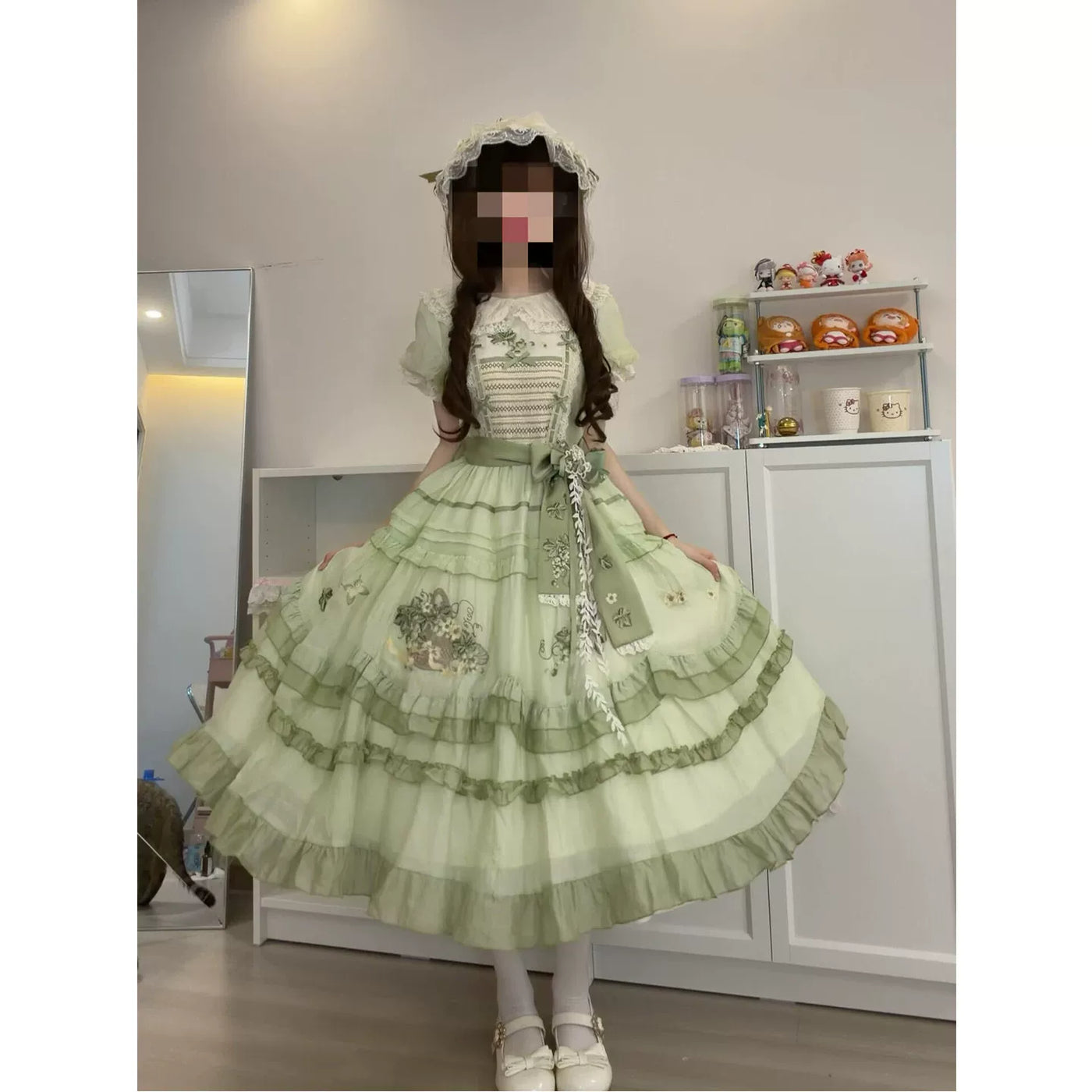 Detail of embroidered bodice and waist sash on green Lolita OP dress
