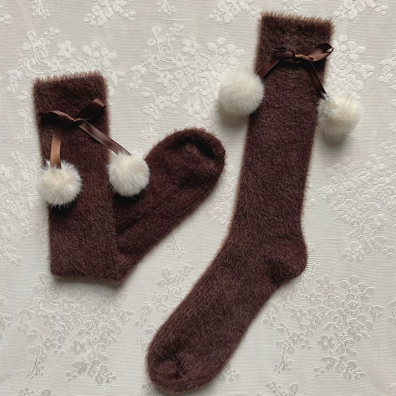 Brown fluffy mid-calf slouch socks with ribbon bows and white pom-poms