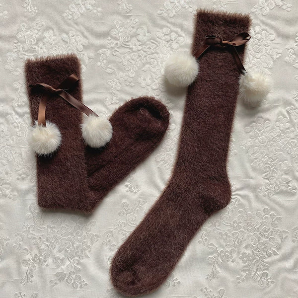 Brown fluffy mid-calf slouch socks with ribbon bows and white pom-poms