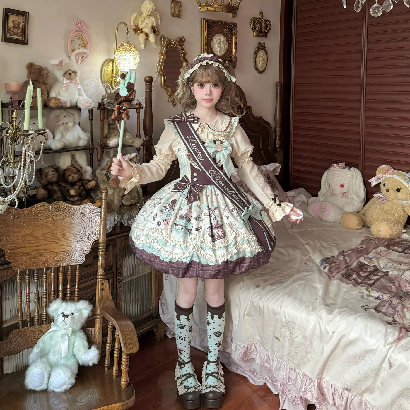 Xian Diandian Chocolate Cat jumper skirt in mint and cocoa tones, shown with bow accents.