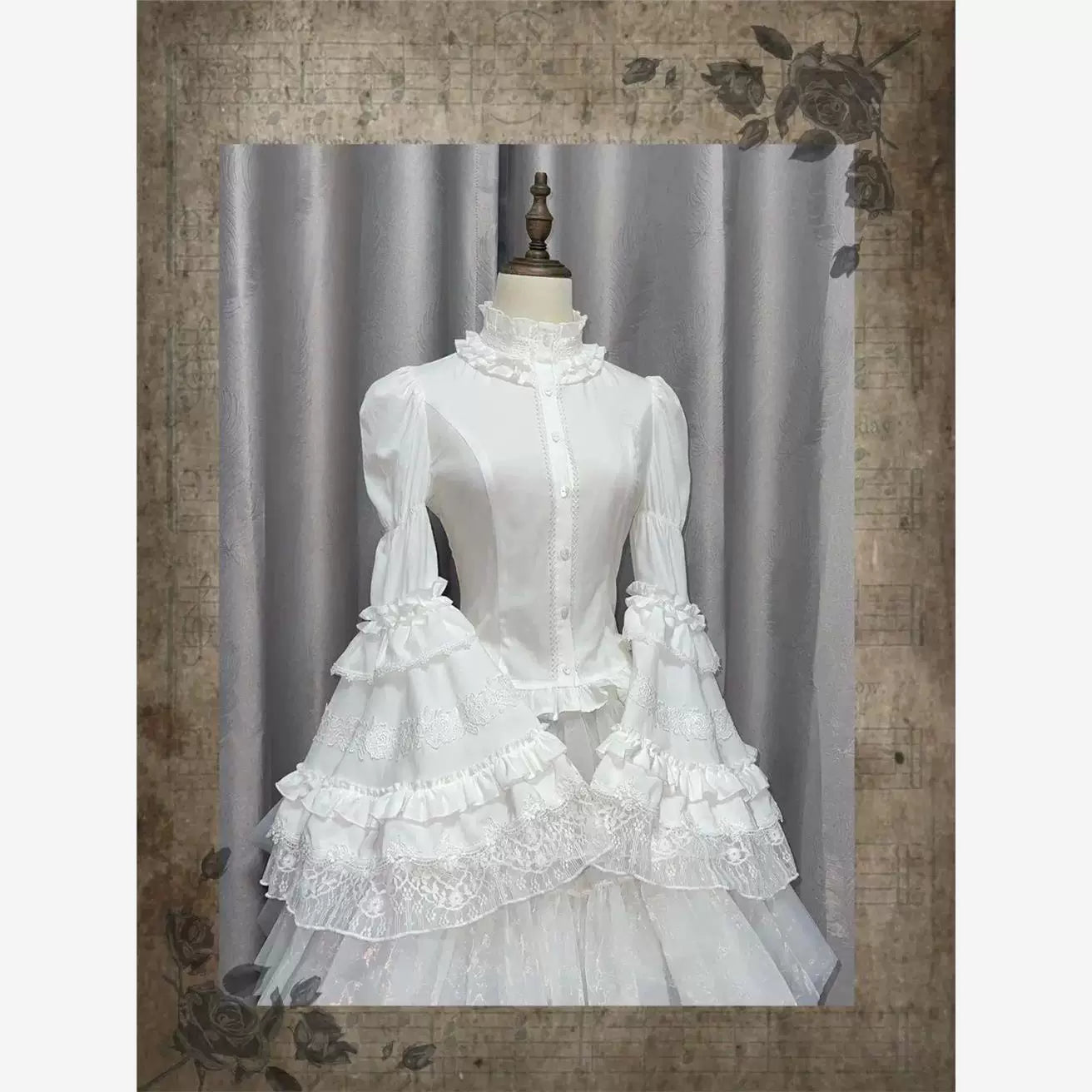 White and black ruffled blouses with lace trim, front buttons, and gathered puff sleeves.