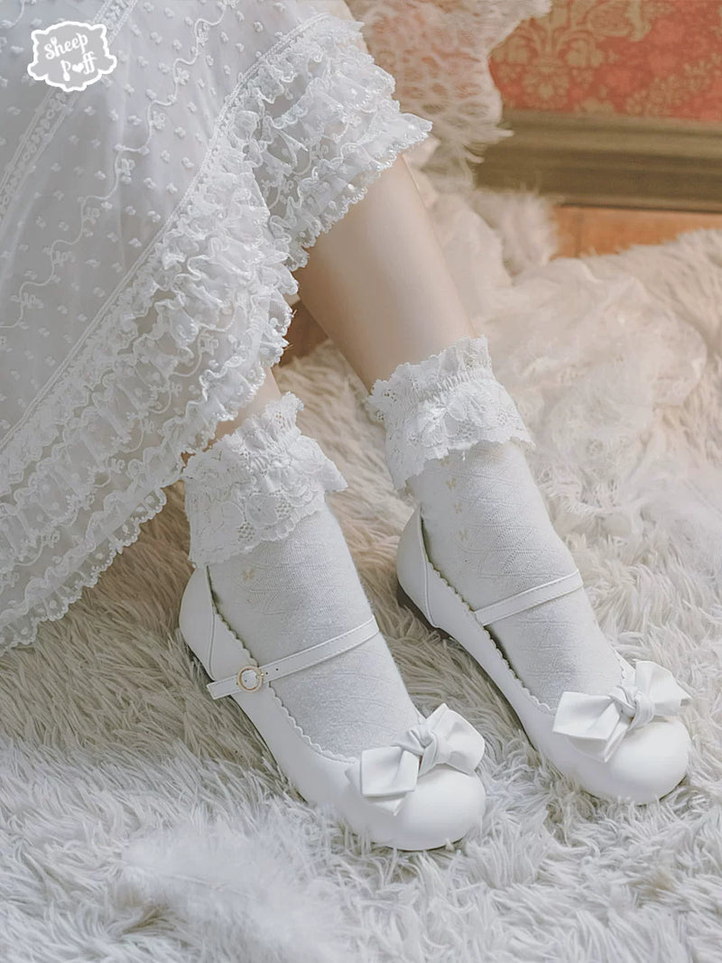 Sheep Puff Sakura matte Lolita shoes with rounded bow detail and soft pink finish, showcasing the stylish shoe design.